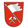 Ein roter Schild mit einer weißen Flagge oben und zwei gekreuzten Hämmern darunter.