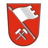 Ein roter Schild mit einer weißen Flagge oben und zwei gekreuzten Hämmern darunter.