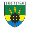 Das Breitenau Wappen zeigt einen Schild mit oben grün, in der Mitte gelb und unten blau. In der Mitte befindet sich ein Zahnrad, mit Weizen auf jeder Seite. Der Name 'BREITENAU' steht darüber.