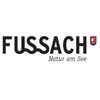 Fussach Nature by the Lake logo, featuring a blue and white boat in a red shield.