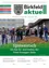 Zeitschriftencover mit einer Gruppe von Menschen in Schutzhelmen, die Schaufeln halten, um einen Haufen Erde herum, mit den Worten 'Spatenstich für den Zu- und Umbau der Peter Rosegger-Halle'.