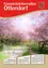 Titelbild einer lokalen Zeitschrift 'Otterndorf' mit einem hellrosa blühenden Kirschbaum-gepflasterten Weg, einem Holztor und einem blauen Himmel im Hintergrund.