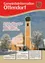 Das Titelbild der Dezember-Ausgabe 2017 einer lokalen Zeitschrift zeigt einen Kirchturm mit einem Dachreiter, schneebedeckte Bäume und ein verschneietes Gebäude im Hintergrund. Eine Nachricht auf dem Cover lautet: 'Ein frohes Weihnachtsfest sowie ein gutes und gesundes neues Jahr...' (Frohe Weihnachten und ein glückliches und gesundes neues Jahr...) und ist unterzeichnet von Bürgermeister, Gemeindeausschuss und lokalen Religionsführern von Ottendorf an der Rittschein.