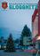 Das Cover der Gloggnitzer Zeitschrift zeigt einen geschmückten Weihnachtsbaum vor einem modernen Gebäude. Der Himmel ist bewölkt, und es gibt Straßenlaternen und Gebäude im Hintergrund.