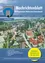 Eine Gemeindezeitung fur die Gemeinde Wollersdorf-Steinabruckl in Osterreich, Juni 2013. Enthalt einen Bericht des Burgermeisters, Burgerinformationen und Service-Updates. Eine Luftaufnahme zeigt die Architektur der Stadt.