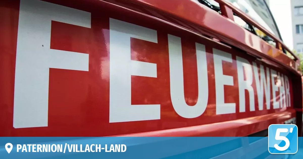 A red fire truck displays the word 'FEUER' in white letters on its side. The image also shows the name 'Villach-Land'.
