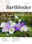 Titelseite einer Zeitschrift mit dem Namen 'Barthlmaer', die eine lebhafte Anordnung von lila und weißen Blumen und Schneeglöckchen auf einem moosigen Hintergrund zeigt. Der Text lautet 'Die Natur erwacht' (Die Natur erwacht).