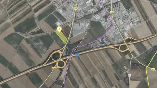 Luftaufnahme einer Straßenkreuzung mit den Autobahnen B50, B52 und S31. Es gibt eine Umgehungsstraße und mehrere Gebäude. Ein Bereich mit '1' ist hervorgehoben.