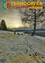 Eine Winterszene mit Sonnenuntergang und schneebedeckten Bäumen. Deutschsprachiger Text und Poesie sind vorhanden, zusammen mit einem Logo und Zeitschriftendetails.