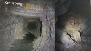 Das Bild zeigt einen Tunnel mit einem Wasserstrom, der hindurchfließt. Es sind Risse in den Wänden und Steine an den Seiten zu sehen. Der Tunnel scheint alt und abgenutzt zu sein.