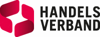 Das Handelsverband-Logo zeigt einen roten Würfel mit einem weißen Stern in der Mitte auf weißem Hintergrund. Der Text 'HANDELSVERBAND' ist in fetten schwarzen Großbuchstaben geschrieben.