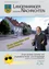 Ein Mann im Anzug steht vor einer Straße mit Häusern. Der Textüberlagerung lautet 'Die neue Ortsdurchfahrt nimmt konkrete Formen an'. Das Bild stammt aus einem Gemeinde-Newsletter, Juni 2010, Ausgabe 99.