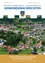 Luftaufnahme eines Dorfes mit Häusern, Bäumen und einem grünen Feld. Das Dorf hat ein burgartiges Gebäude und eine Website-Adresse.