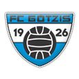 Das FC Gotzis Logo zeigt einen blauen Schild mit einem Volleyball in der Mitte, versehen mit den Nummern 19 und 26.