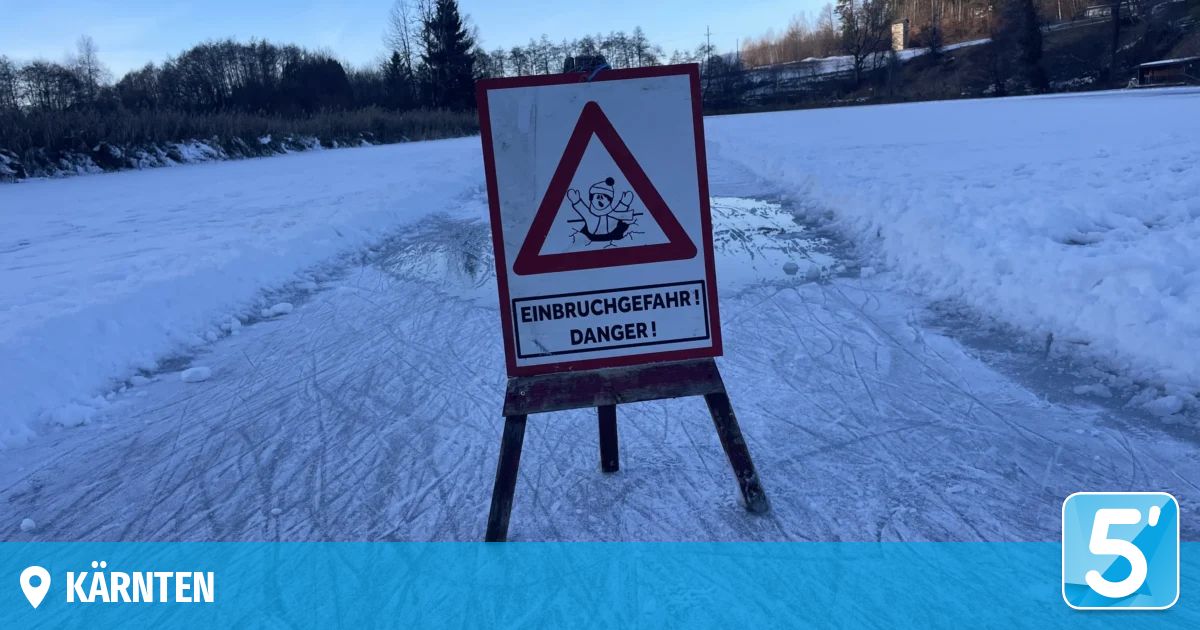 A triangular warning sign in snowy landscape. It shows a person cracking ice and the words Einbruchgefahr! Danger! in German.