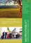 Ein Poster zeigt eine grüne und gelbe Landschaft mit einem Baum und Bergen im Hintergrund. Der Text lautet '1. Heiligenkreuzer Kirtag' und erwähnt den 16. und 17. September. Die Veranstaltung umfasst Musik, Spezialitäten und Produkte aus Gemeinden, sowie ein Treffen von Oldtimerfahrzeugen. Weitere Informationen finden sich auf Seite 2 und 3.