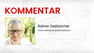 Ein Banner mit dem Titel 'COMMENTAR' zeigt ein Foto und den Namen einer Person, Rainer Seebacher, mit einer E-Mail-Adresse. Der Hintergrund des Bildes ist unscharf.