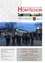 Ein Plakat für die Gemeindezeitung von Horitschon. Es zeigt eine Gruppe von Menschen, die Musikinstrumente in einer Straße spielen. Der Text lautet Horitschon, Gemeindezeitung für Horitschon und Unterpetersdorf, und 12/17. Das Datum ist 12/17. Der untere Teil des Plakats sagt Ein gesundes und glückliches neues Jahr 2018.