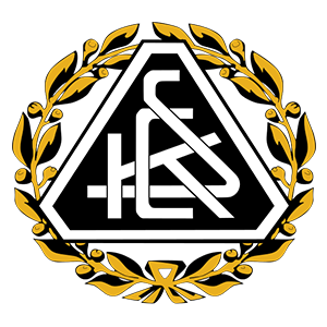 Ein dreieckiges Emblem mit dem Text 'HCS' in Weiß, umgeben von einem goldenen Lorbeerkranz mit gelben Blättern auf schwarzem Hintergrund.