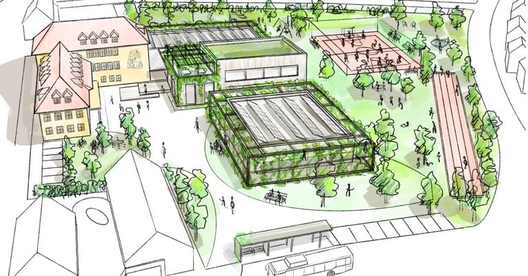 Aerial view of a school complex with buildings, a greenhouse, and outdoor areas with people, trees, and benches.