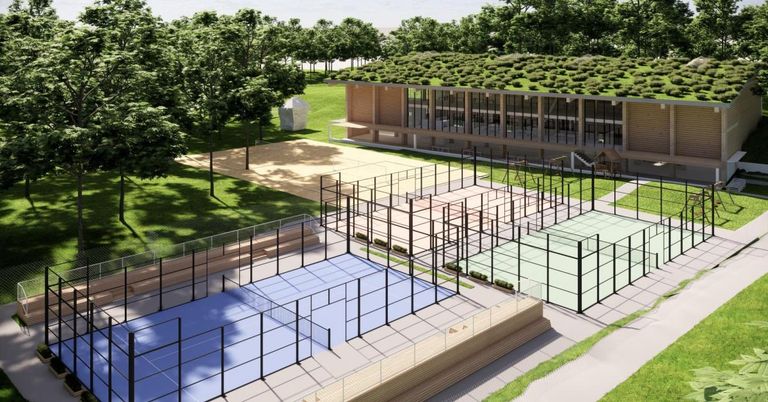 Eine Vogelperspektive auf einen modernen Sportkomplex mit mehreren Tennisplätzen, einem grün gedeckten Gebäude und einem üppigen grünen Park.