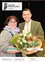 Ein Mann und eine Frau lächeln und posieren für ein Foto, während sie einen Blumenstrauß halten. Die Frau trägt eine Brille und einen Schal, und der Mann ist in einem grünen Anzug. Der Text lautet 'Neue Medizinerin Neuer Gemeinderat angelobt Netzausbau schreibt voran'.