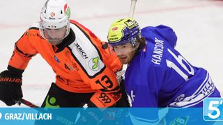 Two hockey players are engaged in a face-off on an ice rink. One player wears an orange jersey with the number 39, while the other wears a blue jersey with the number 15. Both are equipped with helmets.
