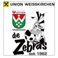 Das Logo von Union Weisskirchen zeigt ein Zebra, das einen Fußball hält, mit dem Text 'Die Zebras seit 1962' unten. Das Logo enthält einen Schild mit dem Text 'UNION' und 'Union' darüber.