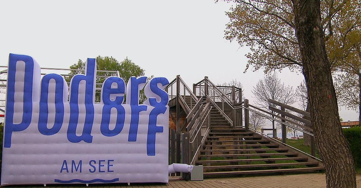 A large inflatable sign reading "Orders Off" stands near a staircase with metal railings. Trees are visible in the background.