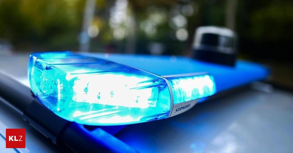 Close up of a blue police car light bar flashing in blue.