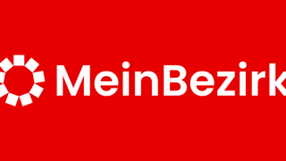 Das Bild zeigt das Wort 'MeinBe' in großen weißen Buchstaben auf rotem Hintergrund. Der Stil ist modern und fett.