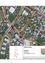 Eine Karte zeigt verschiedene Straßen und Gebäude in einer Stadt. Die Hauptstraße, Tragweiner Straße, ist prominent mit mehreren Kreuzungen dargestellt. Bemerkenswerte Orte umfassen ein großes rotes Kreuz an einer Kreuzung und ein kleineres grünes Kreuz.