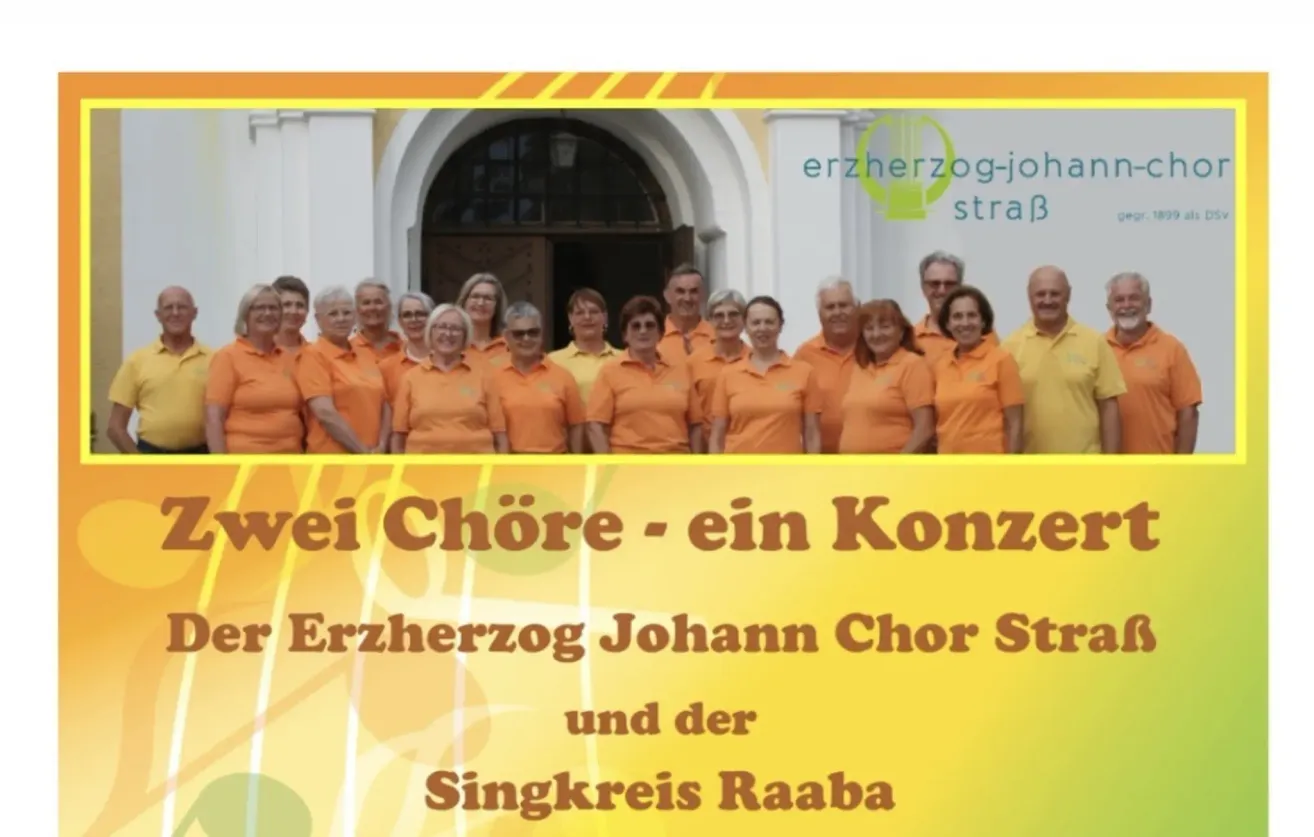 A choir of individuals dressed in orange is standing in front of a building with a logo that reads Erzherzog-Johann. They are likely participating in a cultural event.