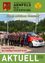 Eine Gruppe von Männern in Uniform steht mit einem Mercedes-Fahrzeug, Blumen und einer Flagge in einem grünen Park. Die Worte 'Einen schönen Sommer' und 'Einweihung MTF der Freiwilligen Feuerwehr Arnfels' sind angezeigt.