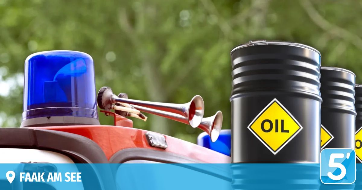An emergency vehicle equipped with a siren and a black oil barrel with a yellow sign is displayed.