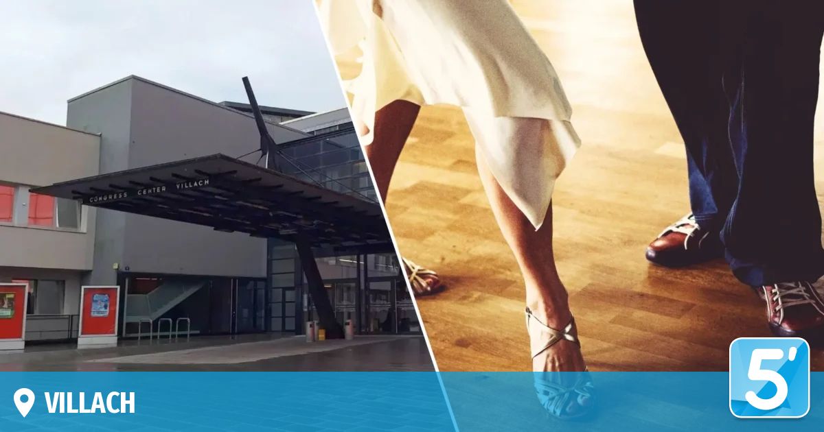 A building with a modern design is on the left, and a person wearing a white dress and sandals is on the right.