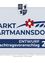 Plakat für die Stadt Hartmannsdorf zeigt einen blauen Schild mit Hund, Krone und Blume. Es steht 'Entwurf 1. Nachtragsvoranschlag 202'. Bevölkerungsdaten: 2.992 Einwohner, 2.924 Hektar.