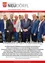 Eine Gruppe formell gekleideter Männer posiert für ein Foto auf einer Konferenz. Der Text am unteren Rand besagt, dass sich kommunale Führungskräfte aus Österreich jährlich auf dem Stadtetag treffen, um kommunale Finanzaufgaben zu diskutieren.