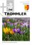 Ein farbenfrohes Feld mit Frühlingsblumen, darunter lila und gelbe Krokusse, mit einem Logo für Der Trommler im Hintergrund.