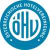 Ein blaues kreisförmiges Logo mit einem stilisierten 'D' und 'W' in der Mitte, umgeben von einem schwarzen Umriss auf schwarzem Hintergrund.