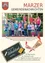 Eine Gruppe von Kindern und zwei Erwachsenen steht vor einem Spielplatz. Die Kinder tragen Freizeitkleidung. Das Bild trägt den Titel '1. Klasse der Volksschule Marz' und ist vom September 2010.