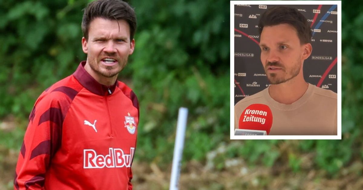 Ein Fußballspieler in einem roten Trikot mit dem Wort RedBull darauf sieht wütend aus. Eingesetzt, ein Mann mit einem Kronen Zeitung-Abzeichen auf seinem Hemd.