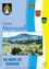 Ein lebendiges Titelbild eines Broschürencovers mit dem Titel 'Unser Mariazell' zeigt eine luftige Ansicht eines Dorfes in den österreichischen Alpen mit üppigem Grün, Bergen und einem klaren blauen Himmel.