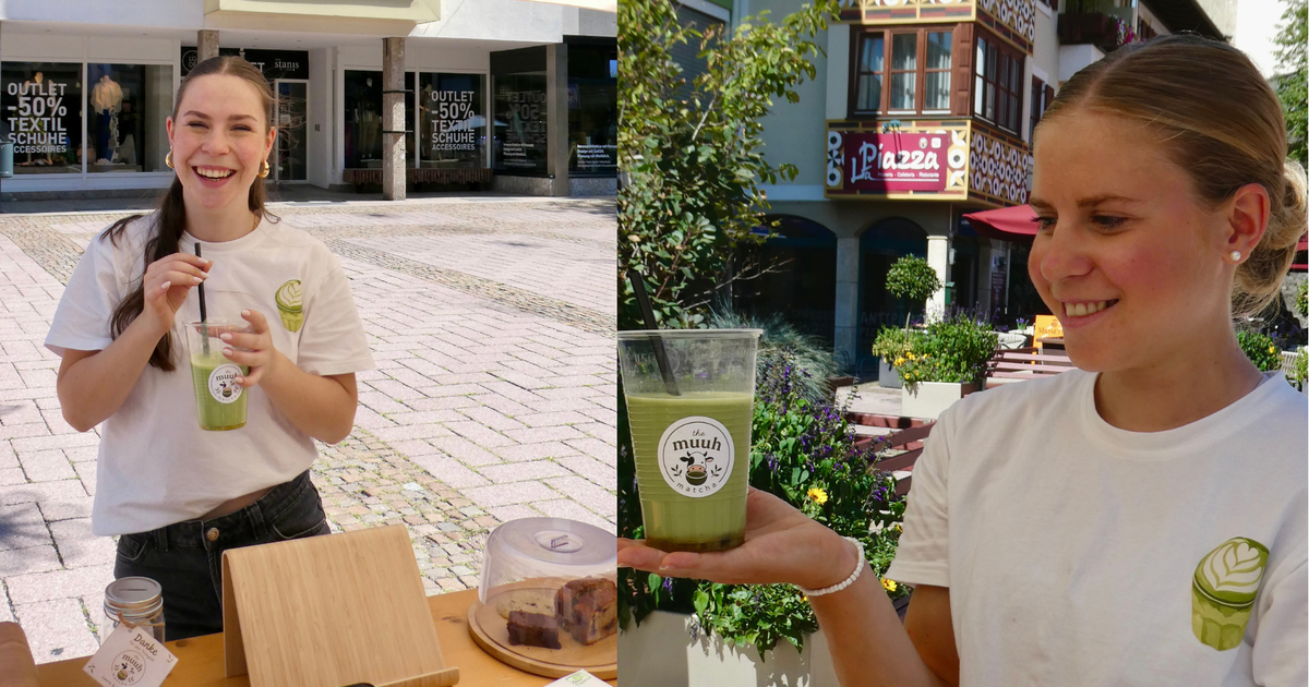 A woman in a white t-shirt holds a cup of green smoothie outside a store with a sign that reads 'Outlet -50%'.