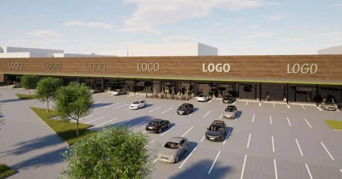 An aerial view of a modern shopping mall with the word 'LOGO' prominently displayed on the front. Several cars are parked in the parking lot, and people are sitting outside the mall.