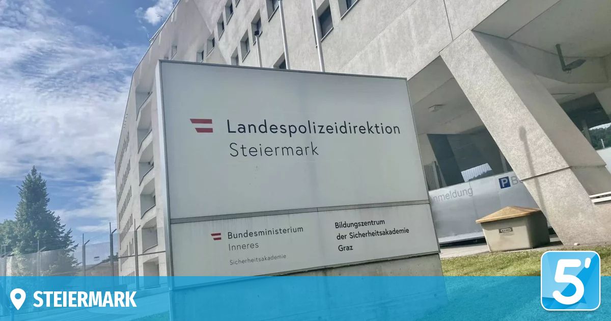 A sign for the Landespolizeidirektion Steiermark, a police headquarters in Graz, Austria. The sign is white with red text and includes the logo of the Bundesministerium Inneres.
