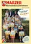 Eine Gruppe von Kindern und Erwachsenen, die Urkunden und Schultaschen halten, steht auf Stufen mit einem gelben Hintergrund und dem Text 'Wir wünschen euch einen schönen Schulstart!'.