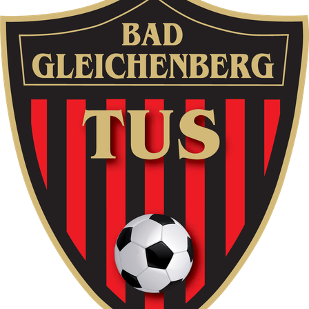 Das Logo der Bad Gleichenberg Fußballmannschaft zeigt einen schwarzen Schild mit goldenem Rand, einem rot-schwarz gestreiften Hintergrund und einem Fußball in der Mitte.