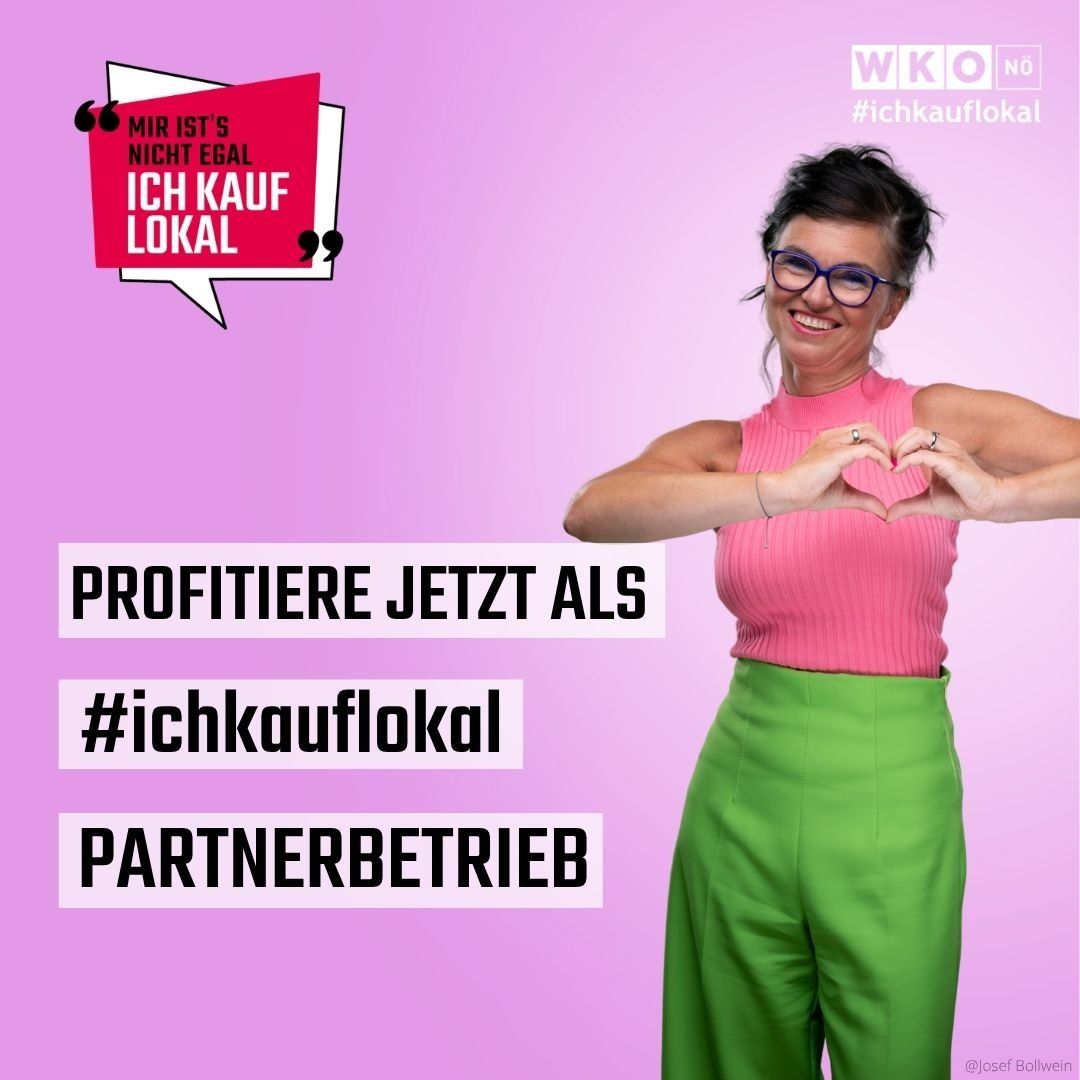 Eine lächelnde Frau in einem rosa Oberteil und grüner Hose bildet mit ihren Händen ein Herz, das gegen einen rosa Hintergrund mit einer Sprechblase steht, die 'Ich kauf lokal' sagt. Der Text darunter lautet 'Profitiere jetzt als #ichkauflokal PARTNERBETRIEB'.