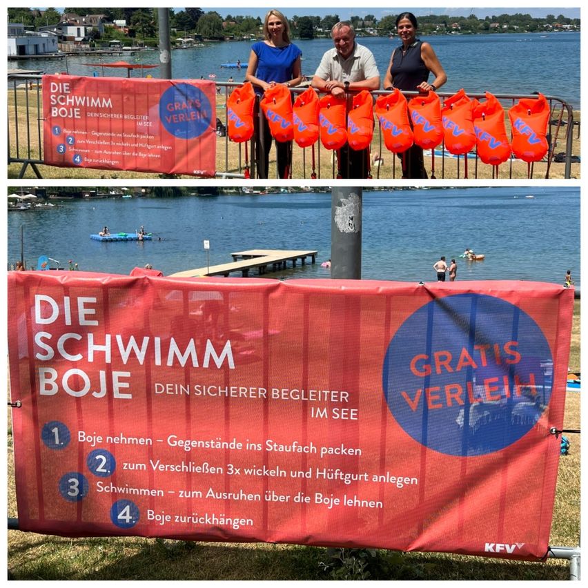 A group of people holding orange life jackets on a railing with a banner behind them. The banner reads 'Die Schwimm Boje' and 'Gratis Verleih'. Below the banner, there are instructions on how to use the life jackets.